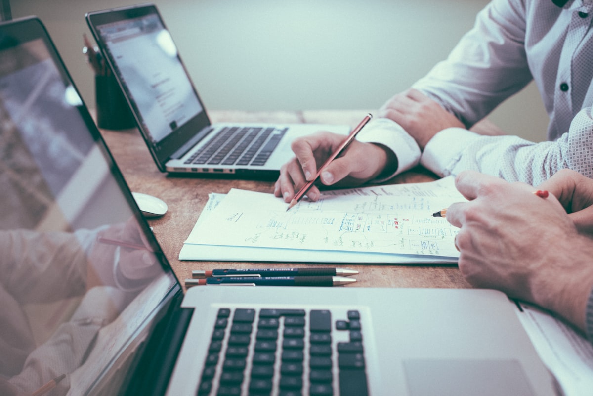Documents and laptop on a desk during financial review